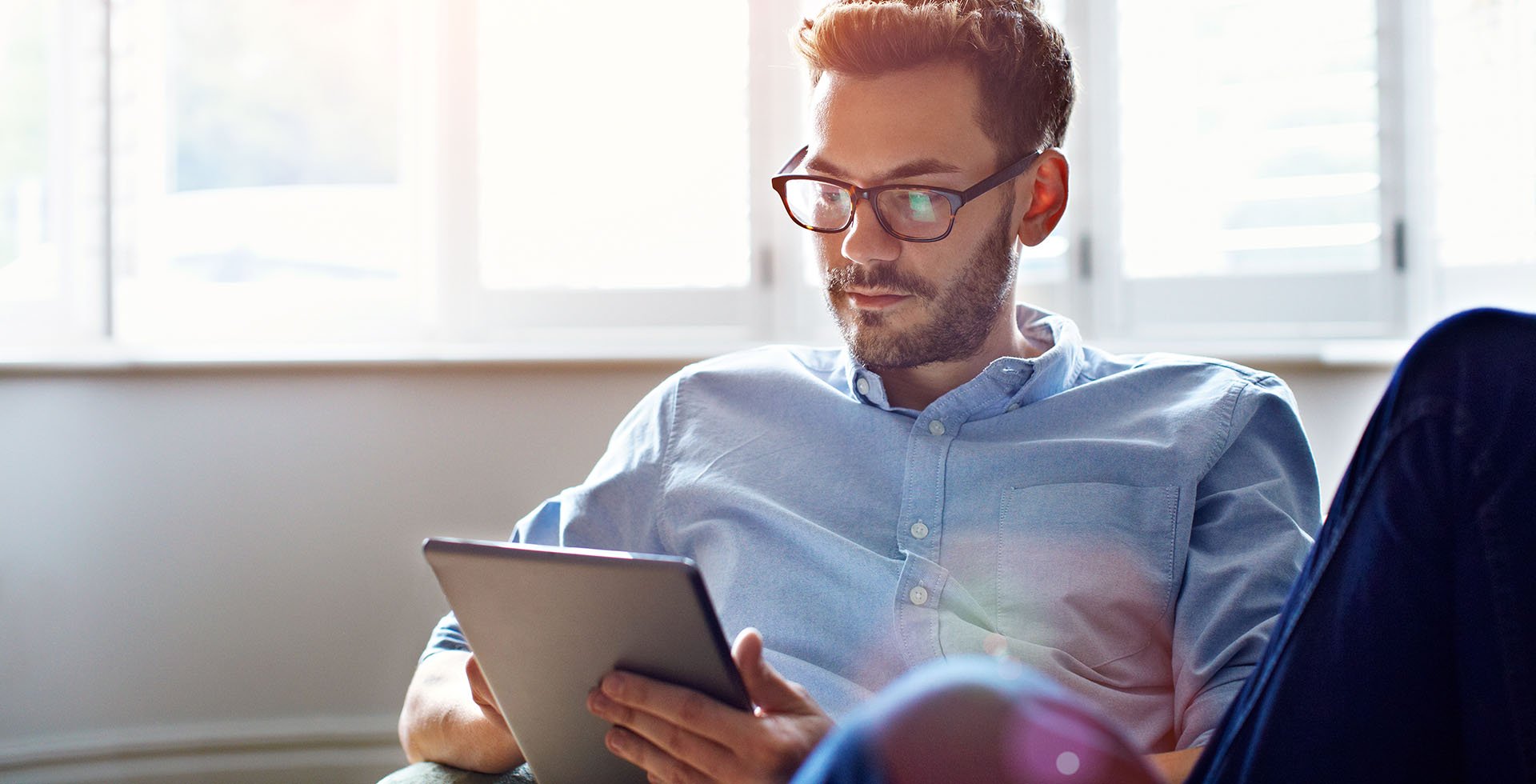 Young man working on an iPad