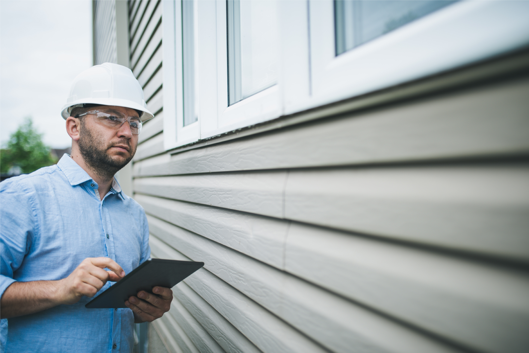 Appraiser looking at a home's exterior